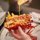 Sauce being poured on a lobster