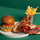 Burger & Lobster combo on green background